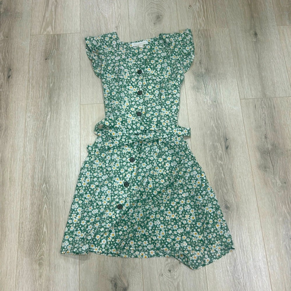 Green floral dress with a tie and brown buttons down the front middle